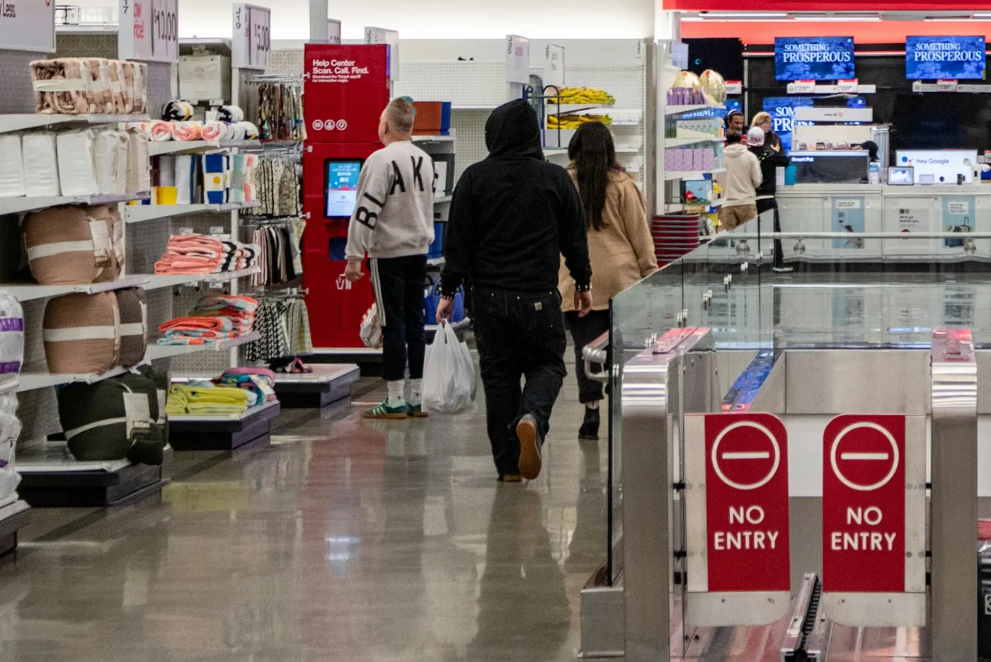 Shoppers inside a downtown Chicago retail store with entry gates