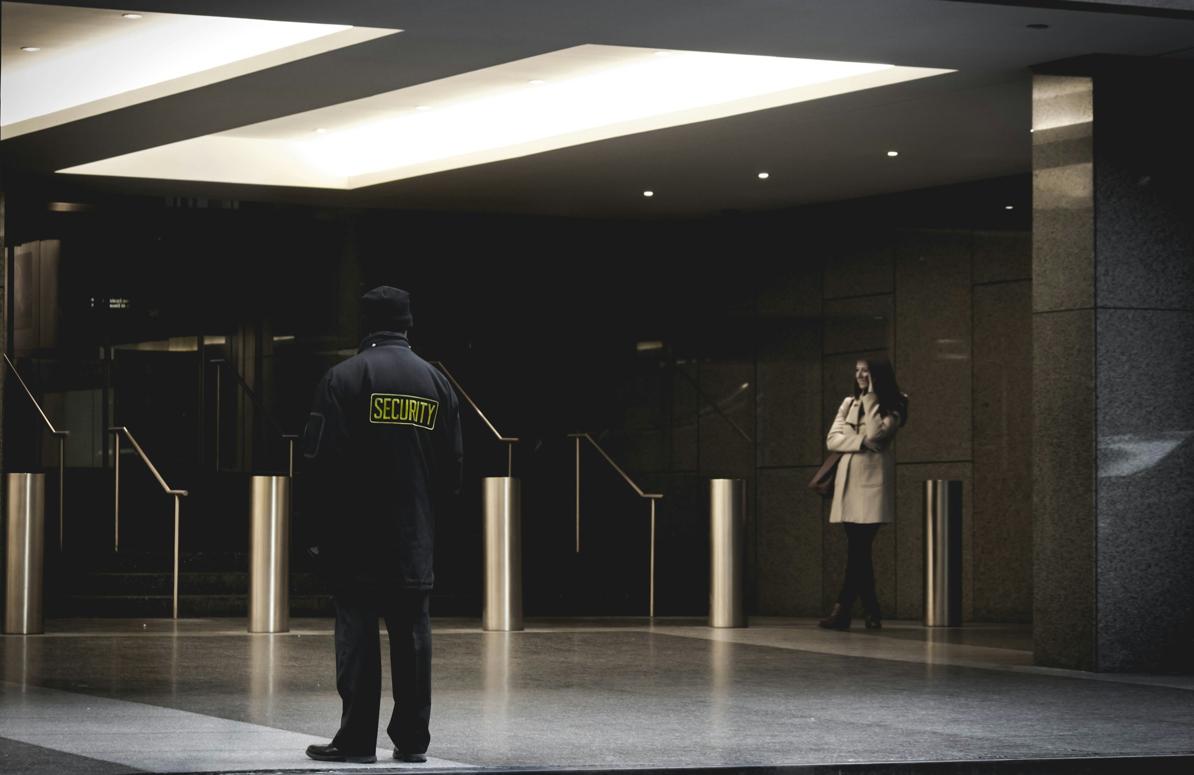 Security guard watching a building entrance